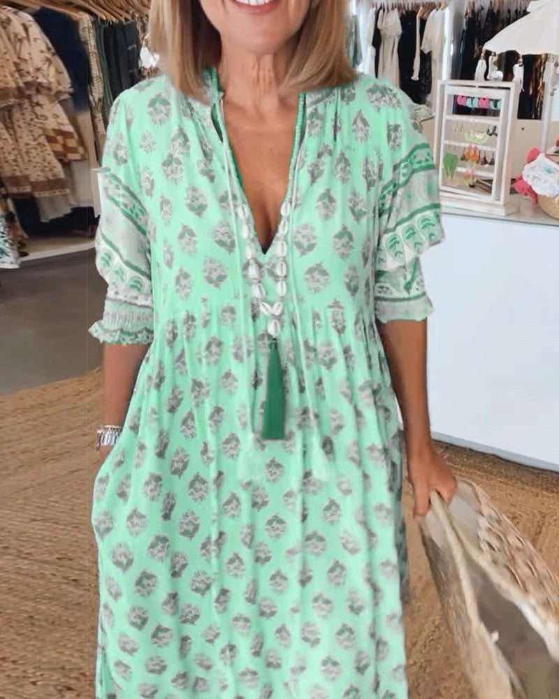 Front view of Cordelia women's floral V-neck flowy dress in green