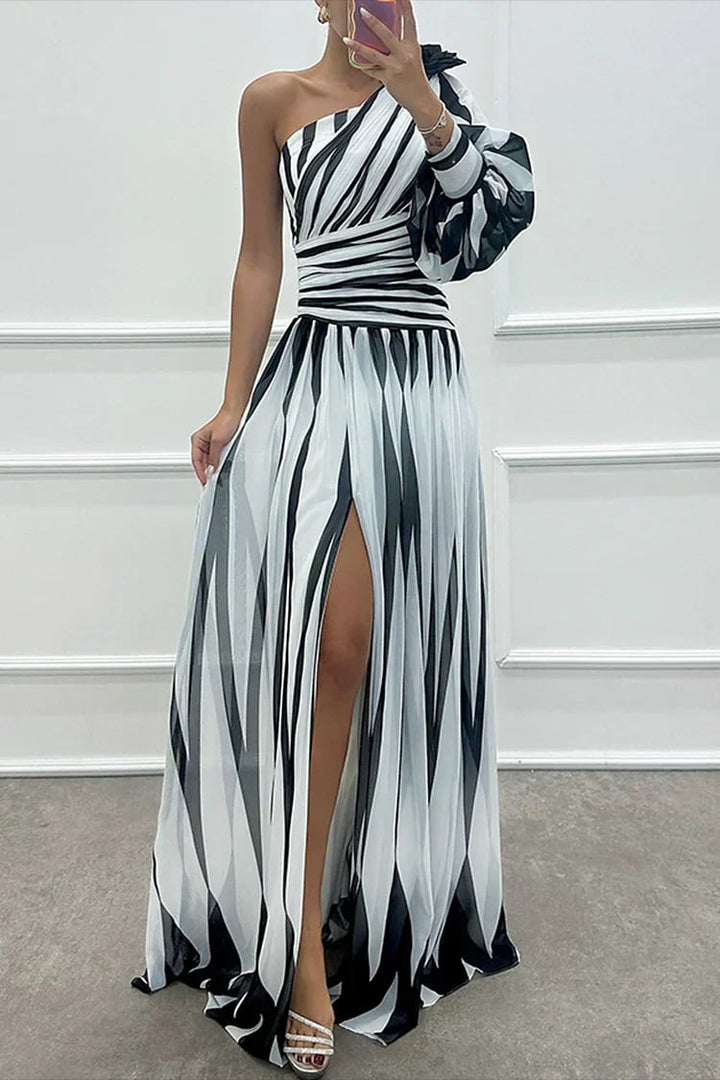 Front view of the Cordelia one-shoulder maxi dress in white showing vertical stripe pattern