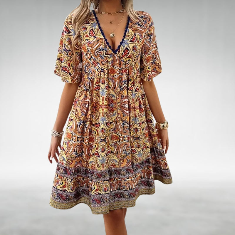Side profile of the Dahlia draped dress showing the graceful silhouette and comfortable, non-restrictive fit