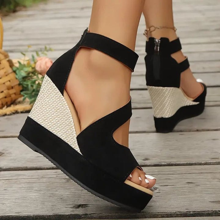 Back view of Dahlia black platform wedge sandals highlighting ankle strap closure