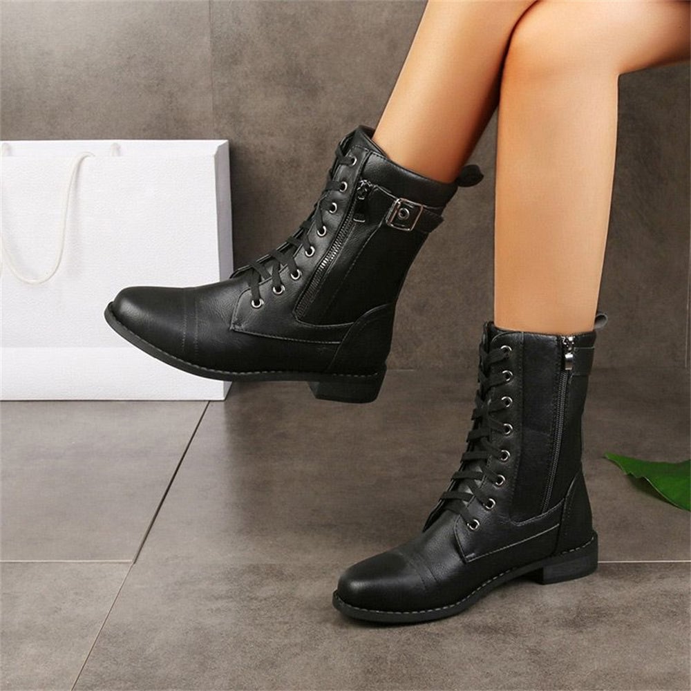 Front view of toe side zipper orthopedic boot in black with rounded toe box and side zipper detail