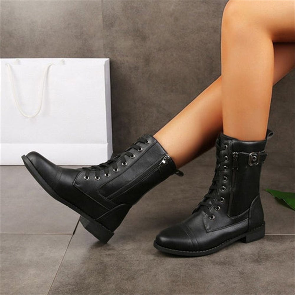 Back view of black orthopedic side zipper boot highlighting ankle support and sturdy heel