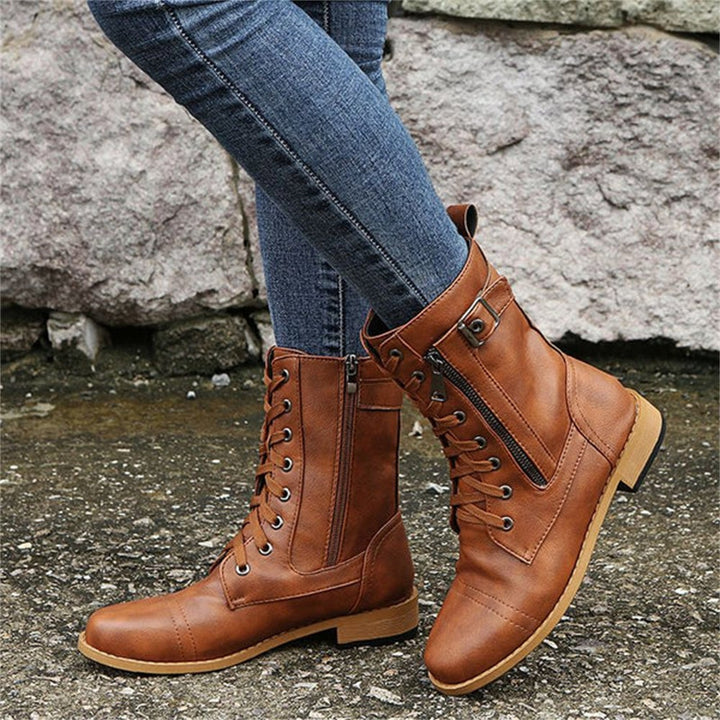 Side-by-side color lineup of orthopedic boots in black, gray, and brown