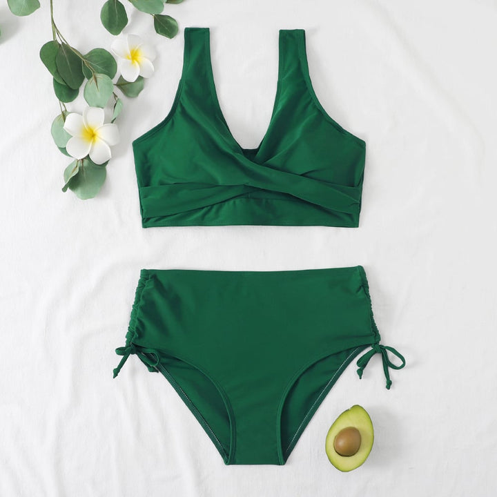 Model in green high-waisted bikini showing stretchy breathable fabric, side view