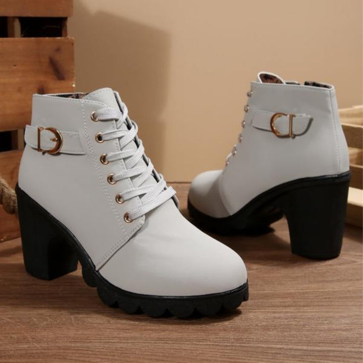 Flat lay of lace-up chunky ankle boots displaying available color options including brown and gray