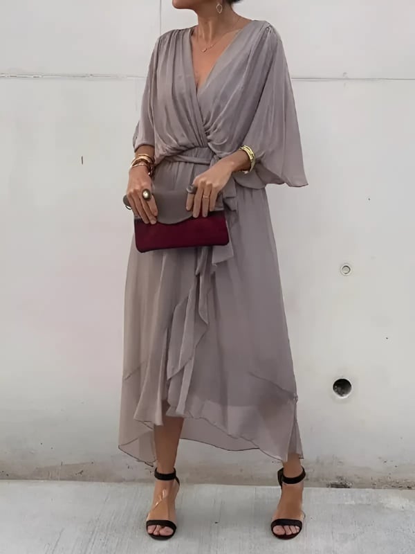 Close-up of the Eden midi dress in grey showing the soft drape and wrap tie detail