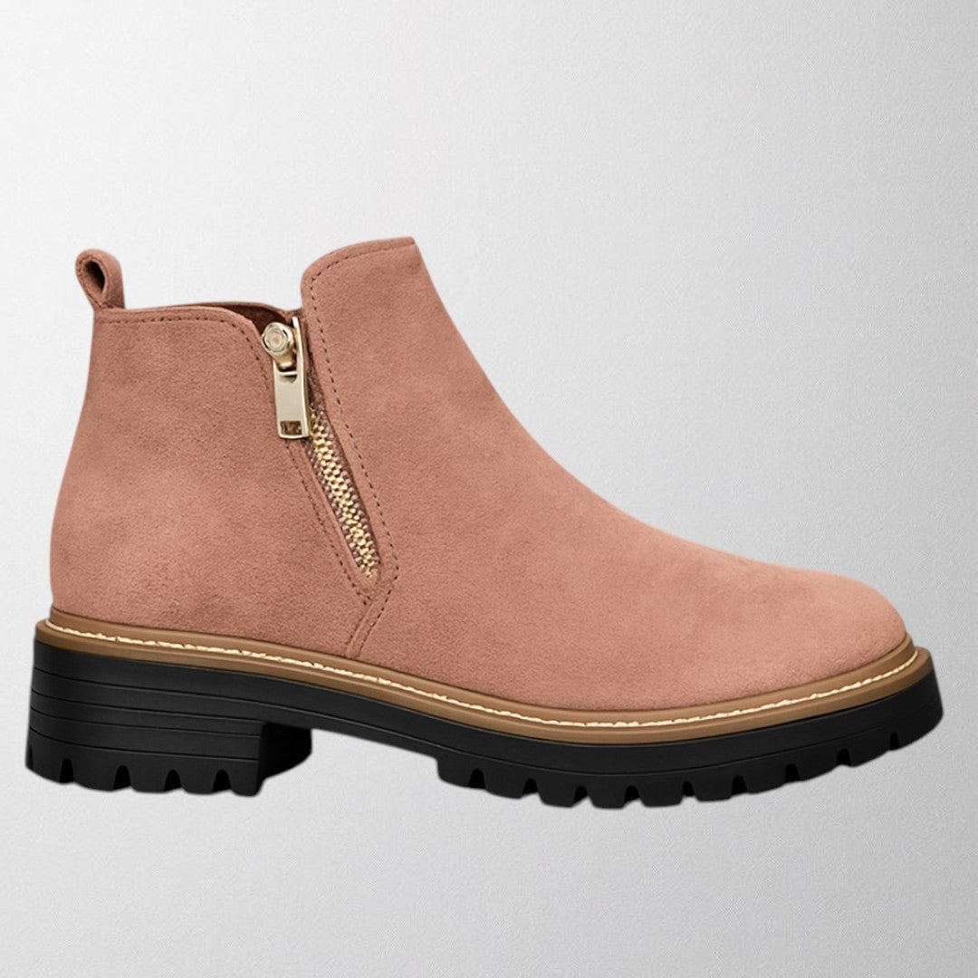 Elma side-zip shoe styled with tailored pants to show versatile everyday pairing