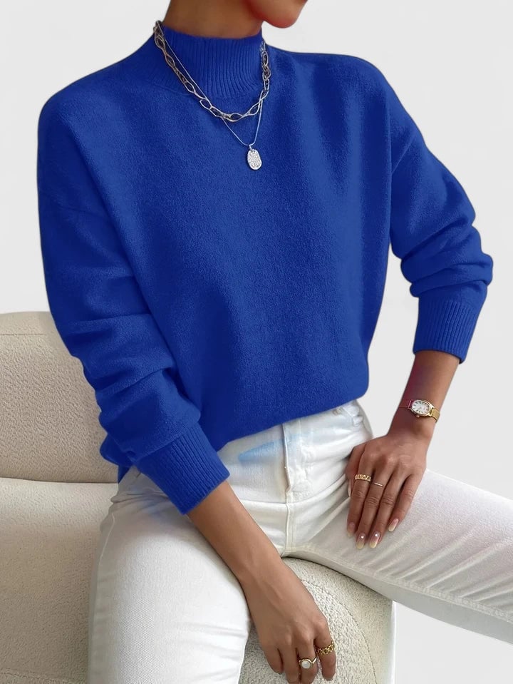 Evelyn turtleneck sweater in blue styled with jeans for a relaxed, polished look