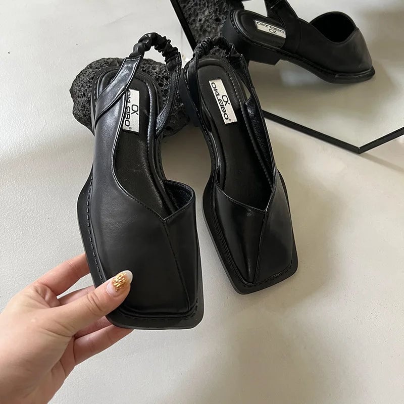 Felicity orthopedic slip-ons in black, angled front view on white background