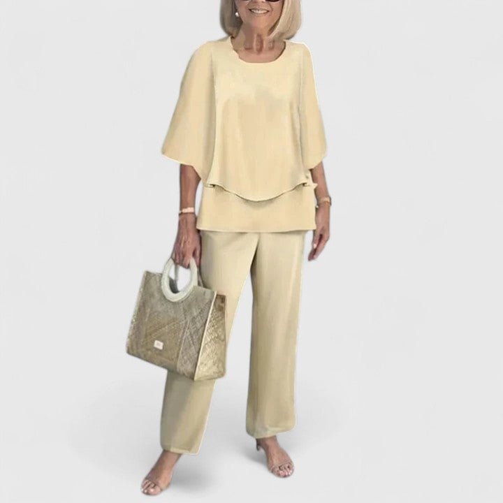 Full-length front view of the Fern set in light green styled with flat sandals