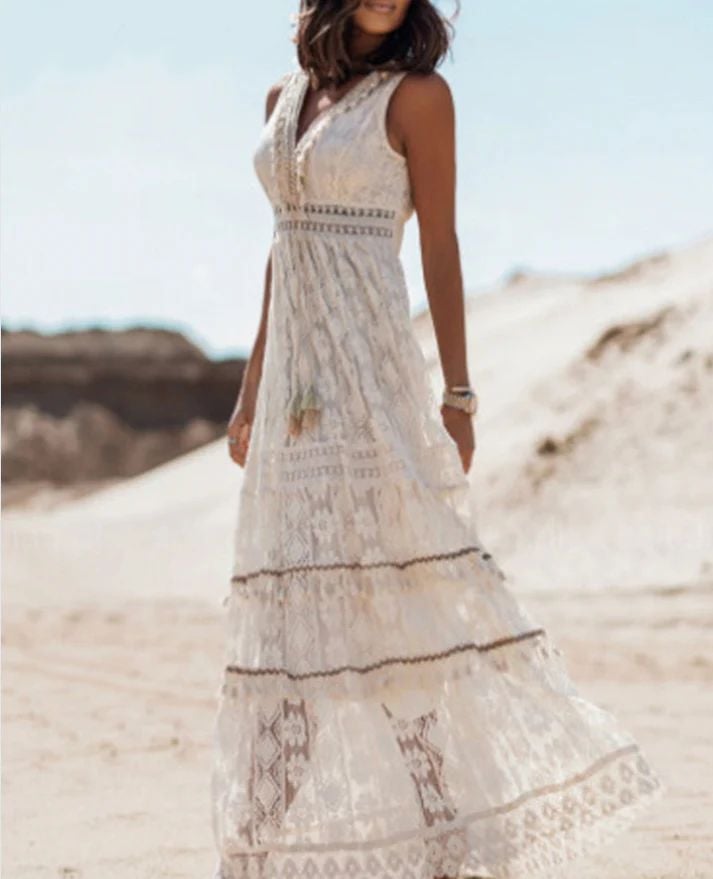 Woman in white Finley boho draped dress, side view showcasing fluid drape and feminine silhouette
