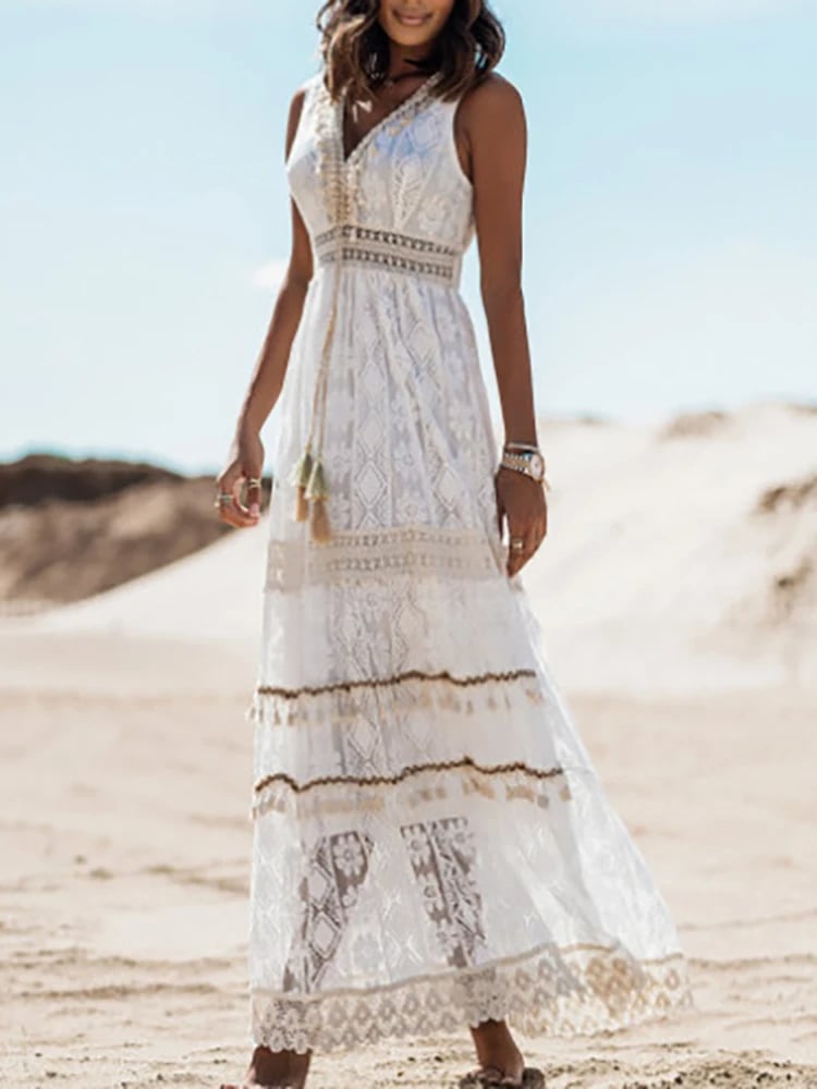 Flat lay of the Finley printed boho dress in white showing full-length print and flowing fabric