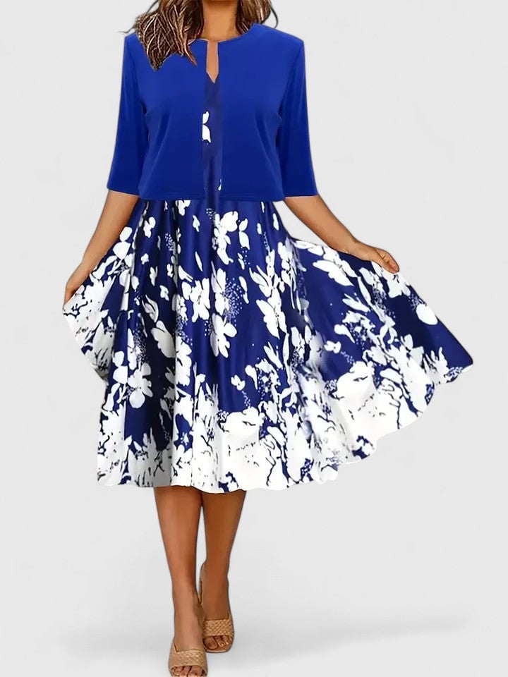 Flora floral midi dress in blue with keyhole button bodice and white botanical-print A-line skirt, front view
