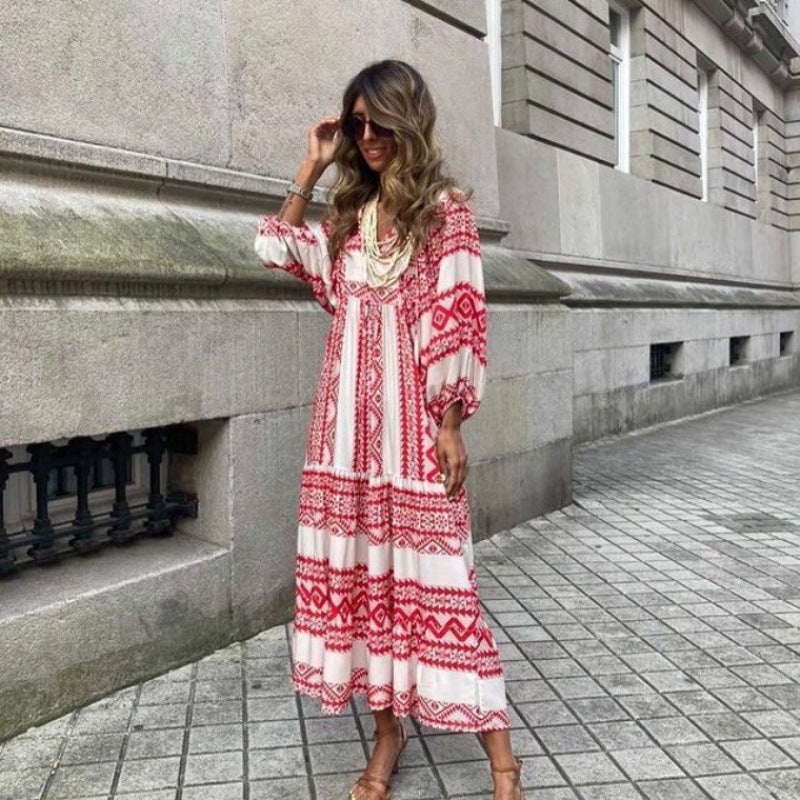Woman in Flora boho maxi dress in sky blue with puff sleeves and tie-neck detail