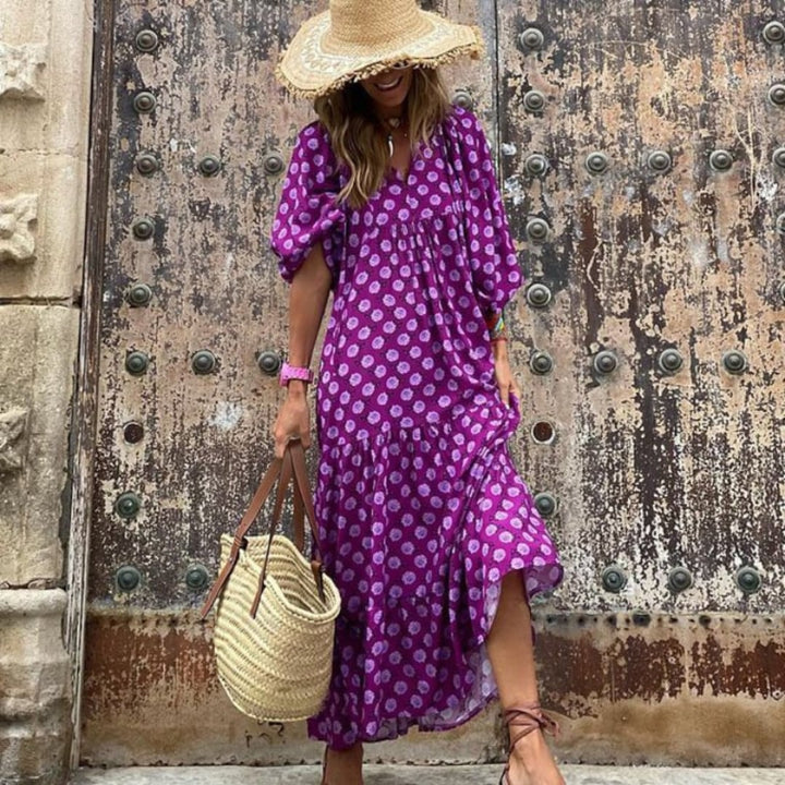 Group of Flora boho maxi dresses in multiple colors displayed on hangers