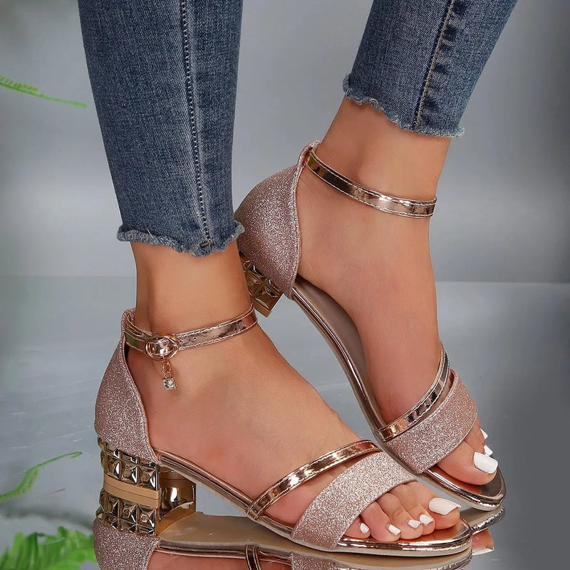 Close-up of adjustable buckle ankle strap on women's block heel sandal