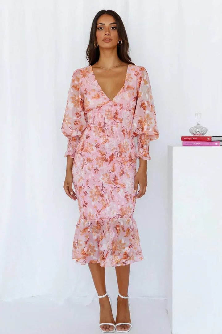 Back view of the Gabrielle floral evening dress in pink highlighting the elegant drape