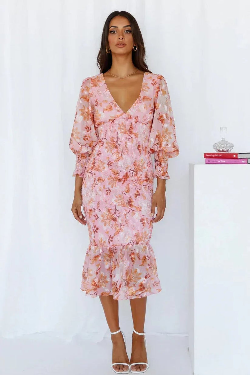 Back view of the Gabrielle floral evening dress in pink highlighting the elegant drape