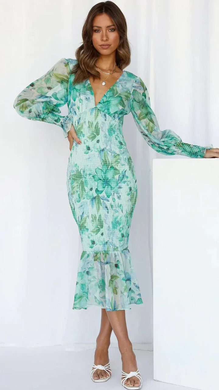 Close-up of the floral print on the Gabrielle draped dress in green