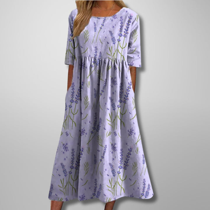 Close-up of the floral midi dress fabric detail highlighting its lightweight, breathable texture