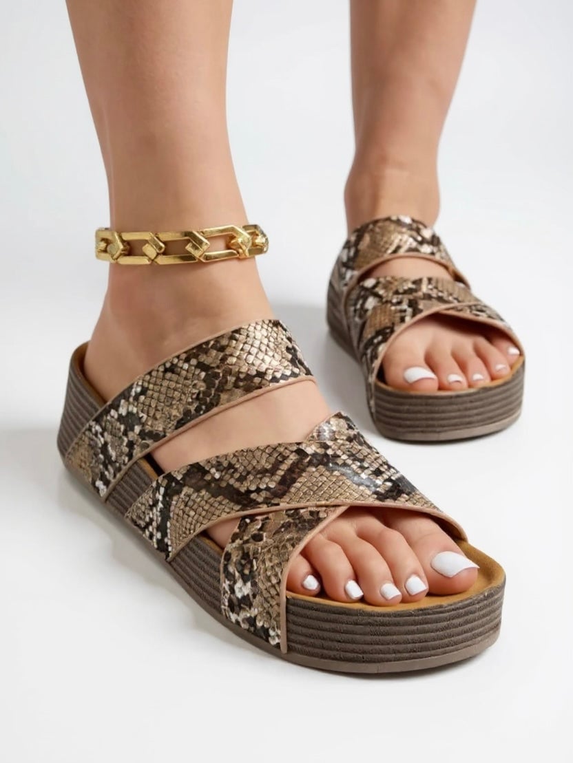 Glade braided platform sandals in black on a clean background, top-down view highlighting woven strap detail