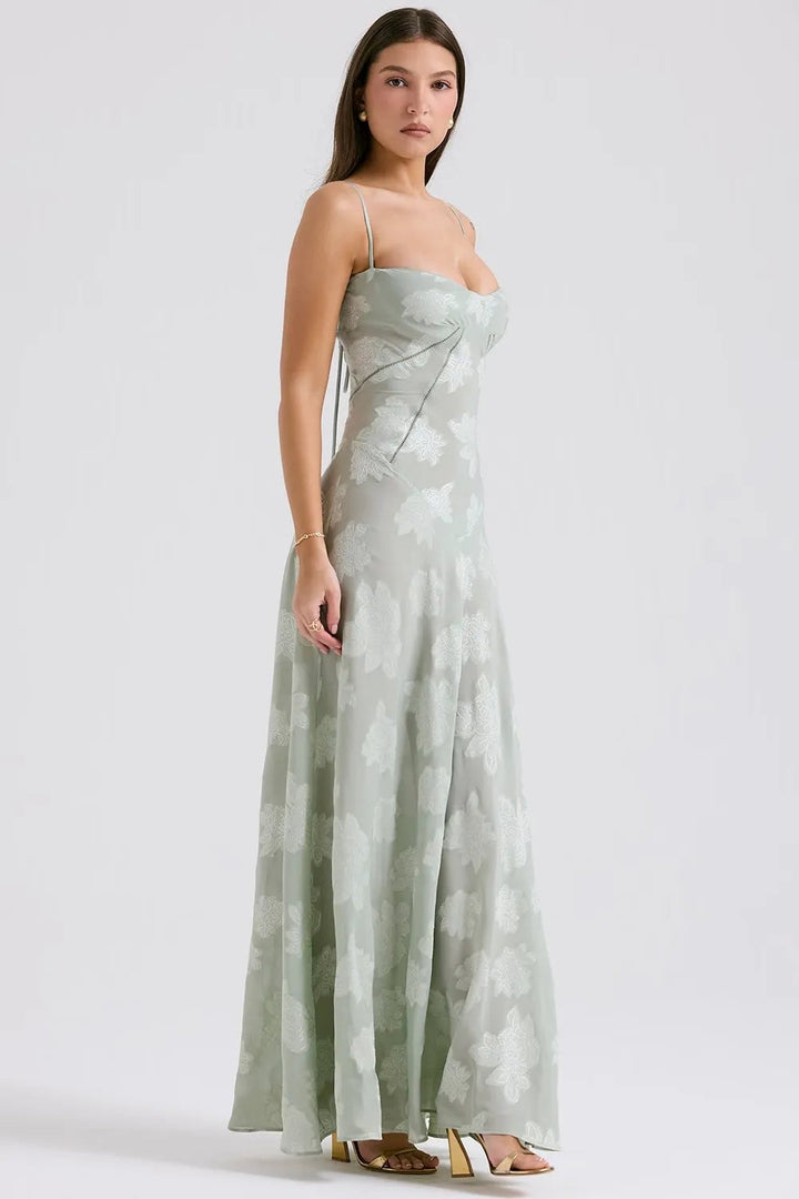 Detail of the spaghetti strap and open back on a long purple summer dress