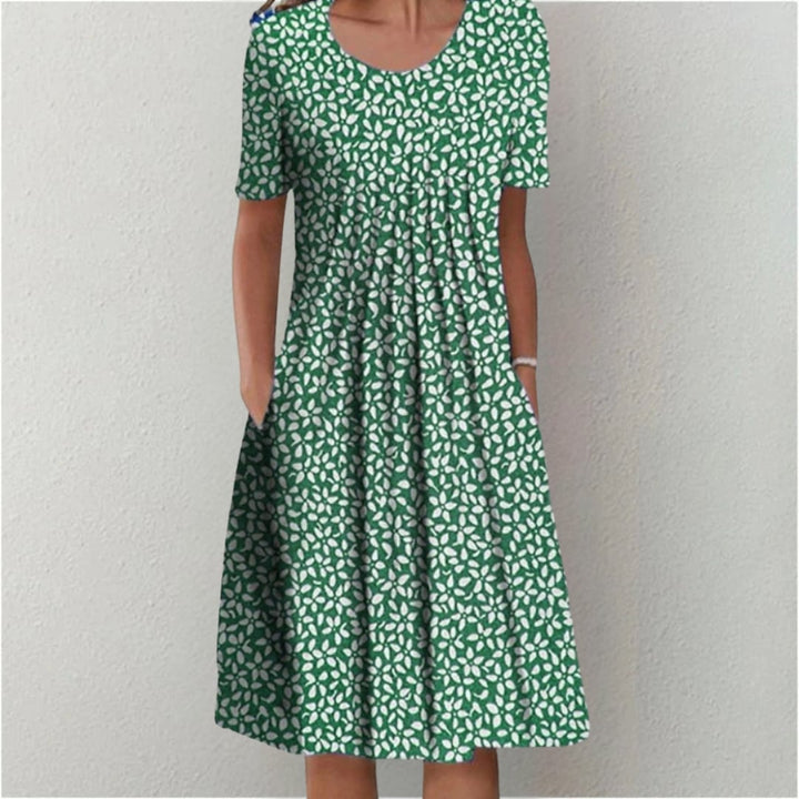 Orange floral dress styled for a vacation look, showing full length and sleeve detail