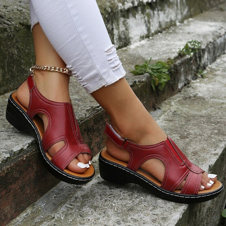 Pair of Heather women's sandals in white showing full silhouette and strap layout