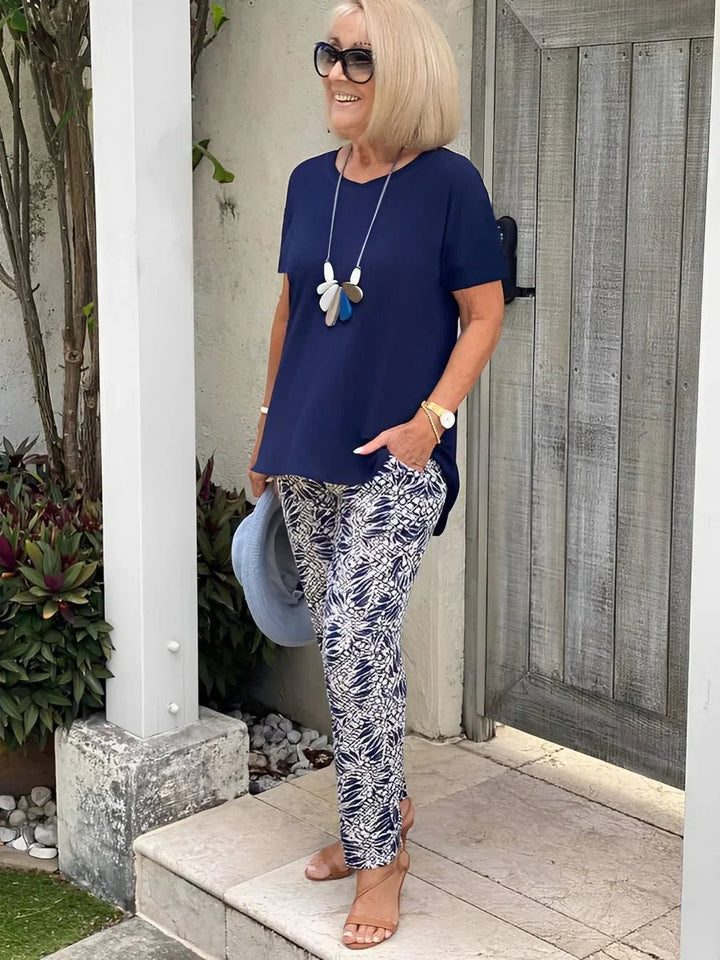 Close-up front view of the BobaFashion Coastal Set wide-leg pants and blouse in blue, showing contrast pattern detail and flowing silhouette