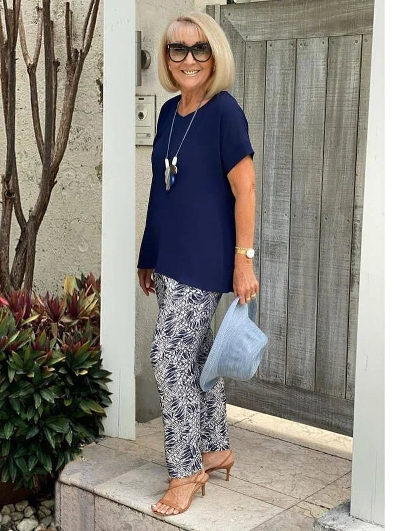 Side profile of the BobaFashion Coastal Set in navy blue highlighting the drape and relaxed fit of the wide-leg pants