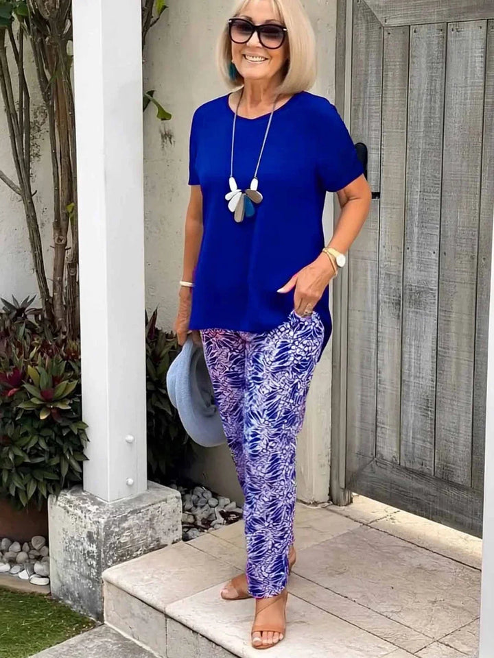 Detail shot of the artistic pattern on the BobaFashion Coastal Set blouse in blue