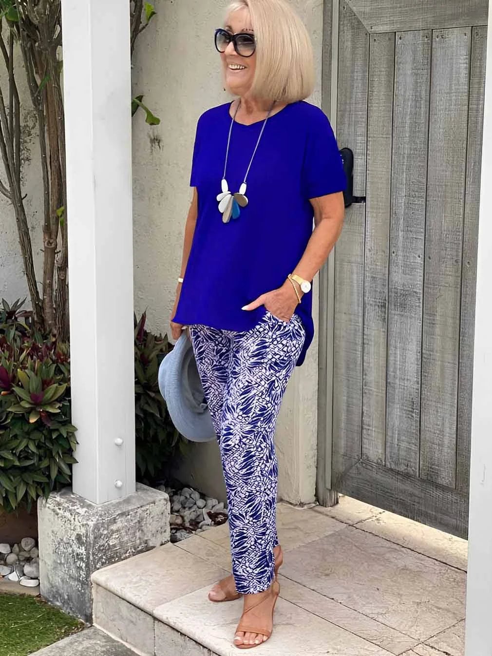 Woman smiling in the BobaFashion Coastal Set in navy blue, styled for a casual outdoor occasion
