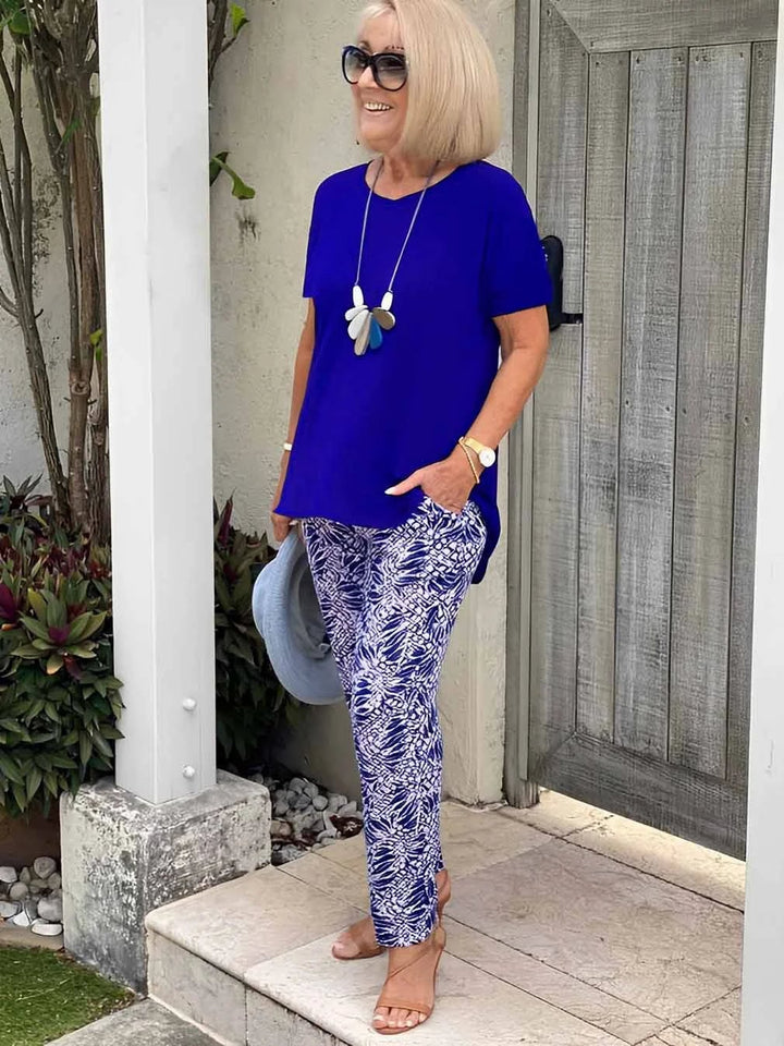 Woman smiling in the BobaFashion Coastal Set in navy blue, styled for a casual outdoor occasion