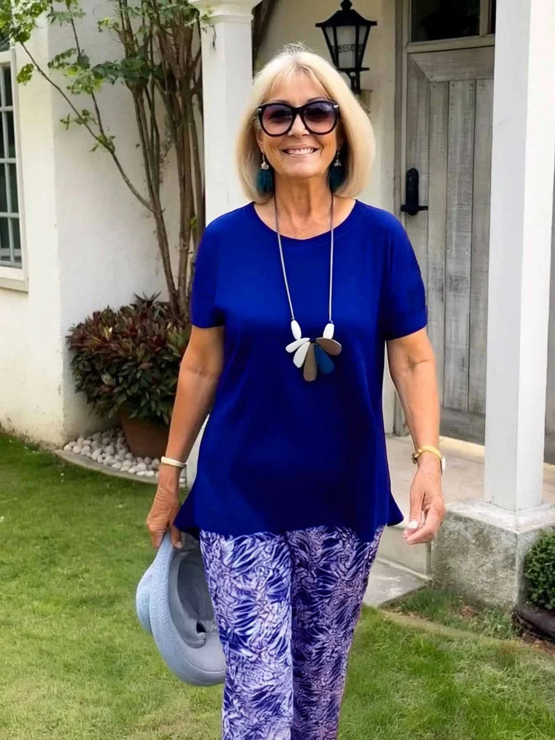 Flat lay of the BobaFashion Coastal Set blouse and wide-leg pants in blue showing the complete two-piece ensemble