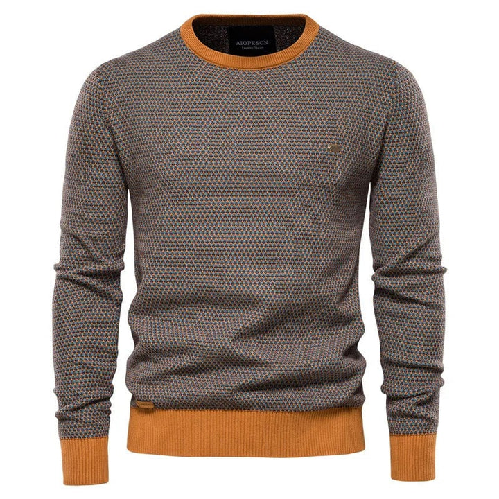 Side profile of man wearing a checkered sweater showing tailored silhouette