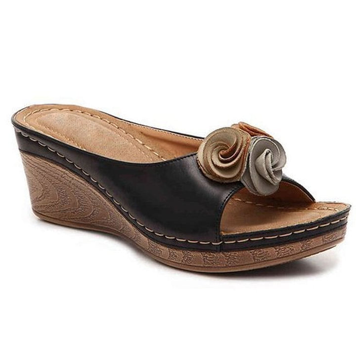 Heron wedge sandals in blue showing ergonomic wedge sole and open-toe design, front angle view