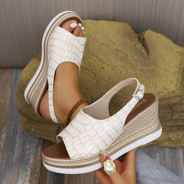 Top-down view of the Imara white wedge sandals showing strap and toe box design