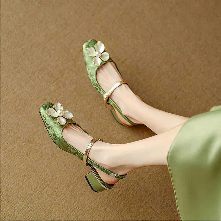 Isabeau floral mary jane pumps in green, rear view showing block heel and buckle detail
