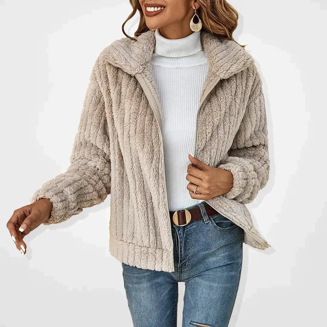 Woman styled in the Isadora fluffy cardigan in pink, layered over a casual outfit