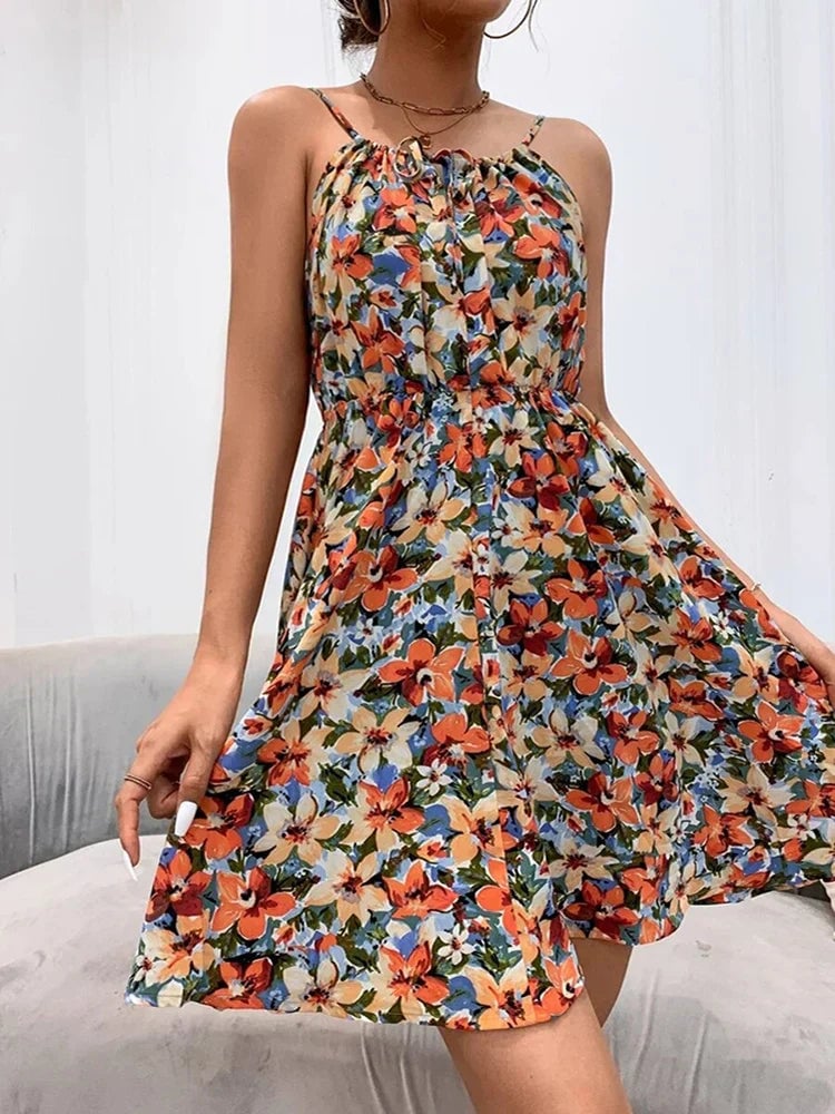 Full-length view of the BobaFashion floral halter dress in orange showing the flowing A-line silhouette