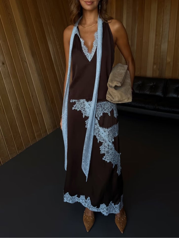 Model in brown and blue lace coordinated top and skirt set, side profile view