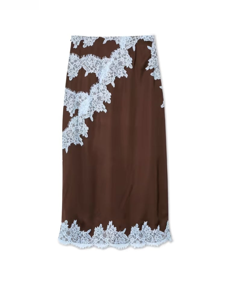 Overhead flat lay of the brown and blue lace panel top and skirt set