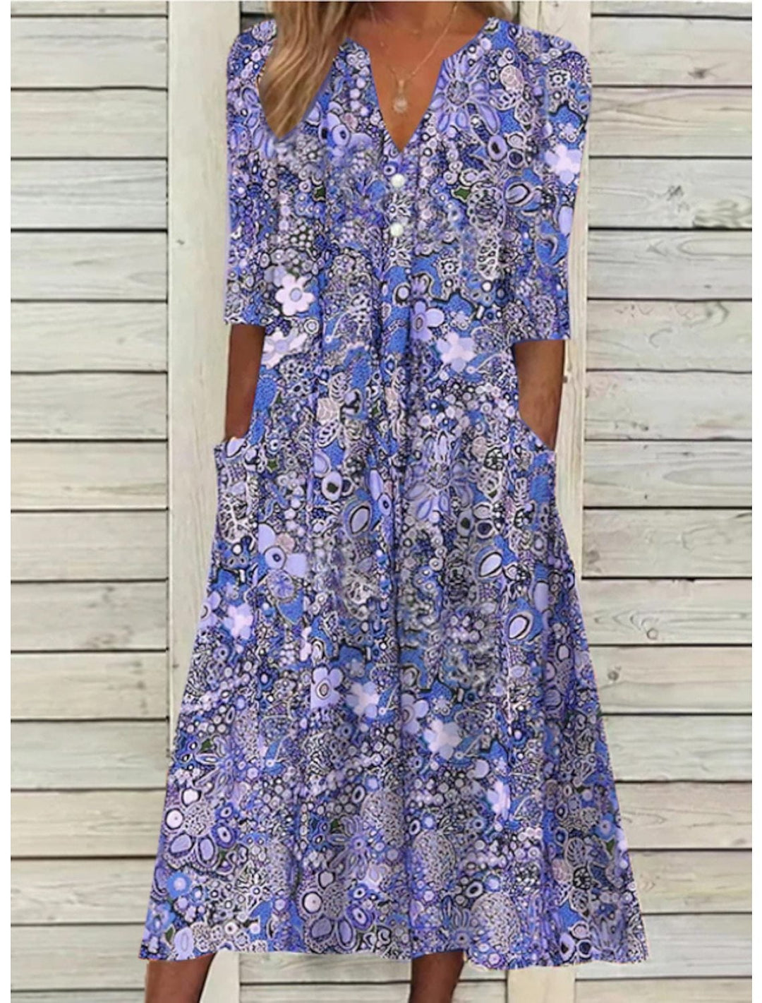 Close-up of the elegant V-neckline and lightweight fabric of the BobaFashion Janice summer dress in blue purple