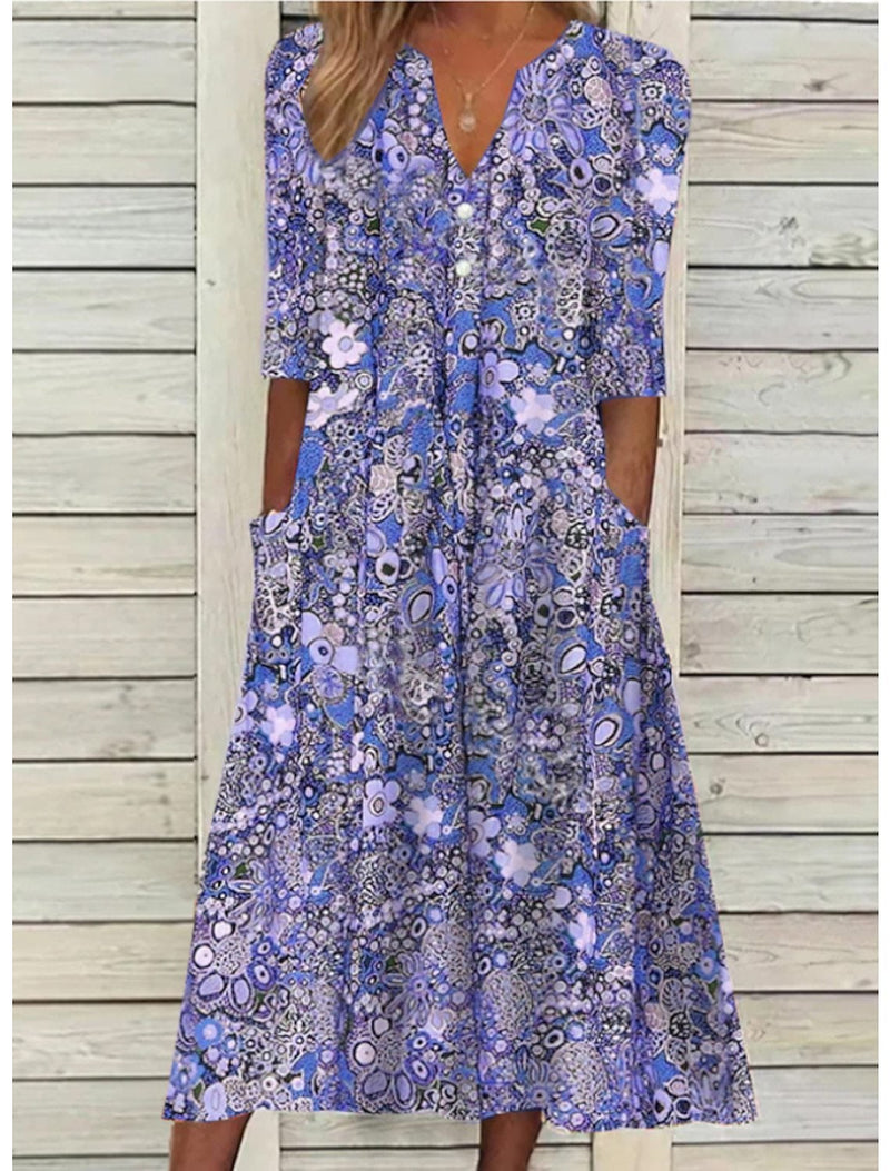 Close-up of the elegant V-neckline and lightweight fabric of the BobaFashion Janice summer dress in blue purple