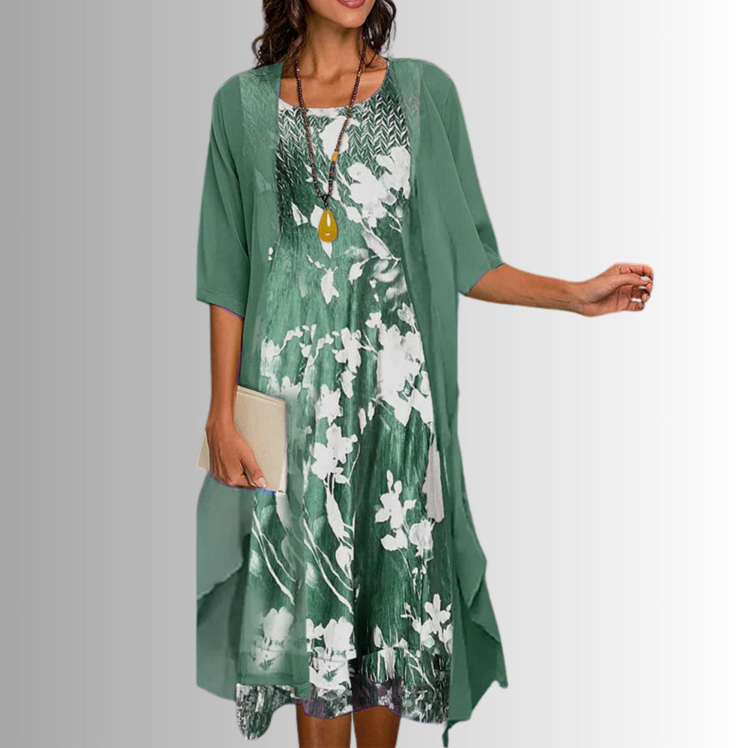 Model wearing a floral green 2-piece short-sleeve blouse and flowy dress set from BobaFashion