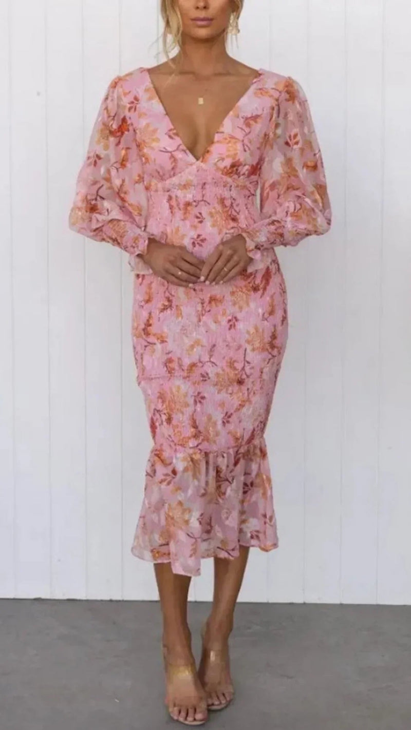 Front view of the Julia floral dress in pink, featuring a flowing silhouette and all-over floral print