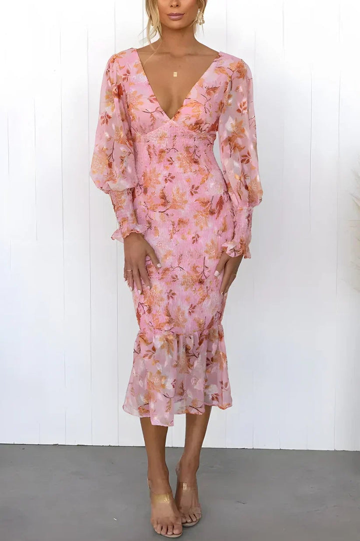 Side view of the Julia floral dress in pink showing the elegant drape and defined waist