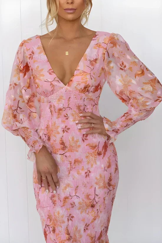 Close-up of the vibrant floral print detail on the Julia dress in pink