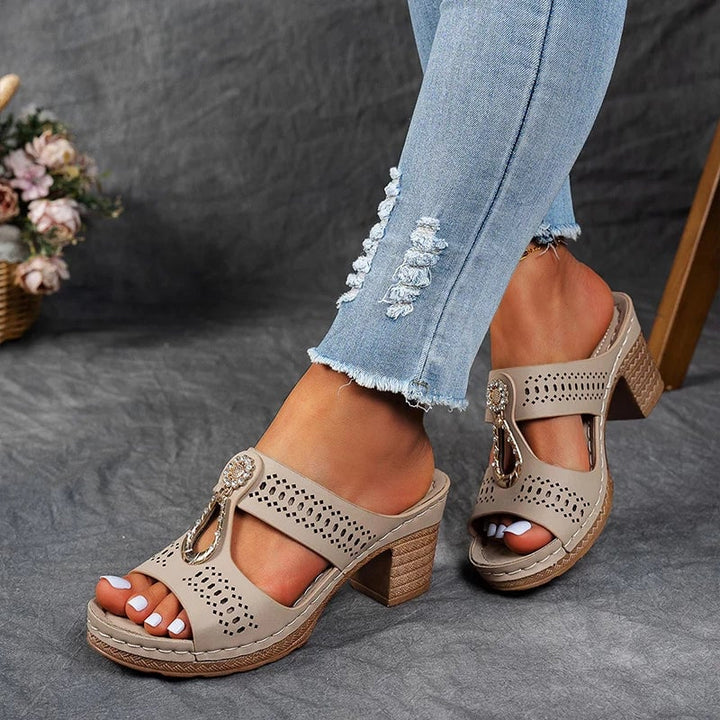 Side profile of women's orthopedic wedge sandal highlighting the 2-inch stabilizing wedge