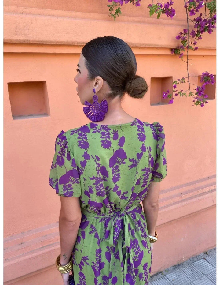 Woman in green BobaFashion summer dress posing outdoors, showcasing the flowing skirt and modern cut
